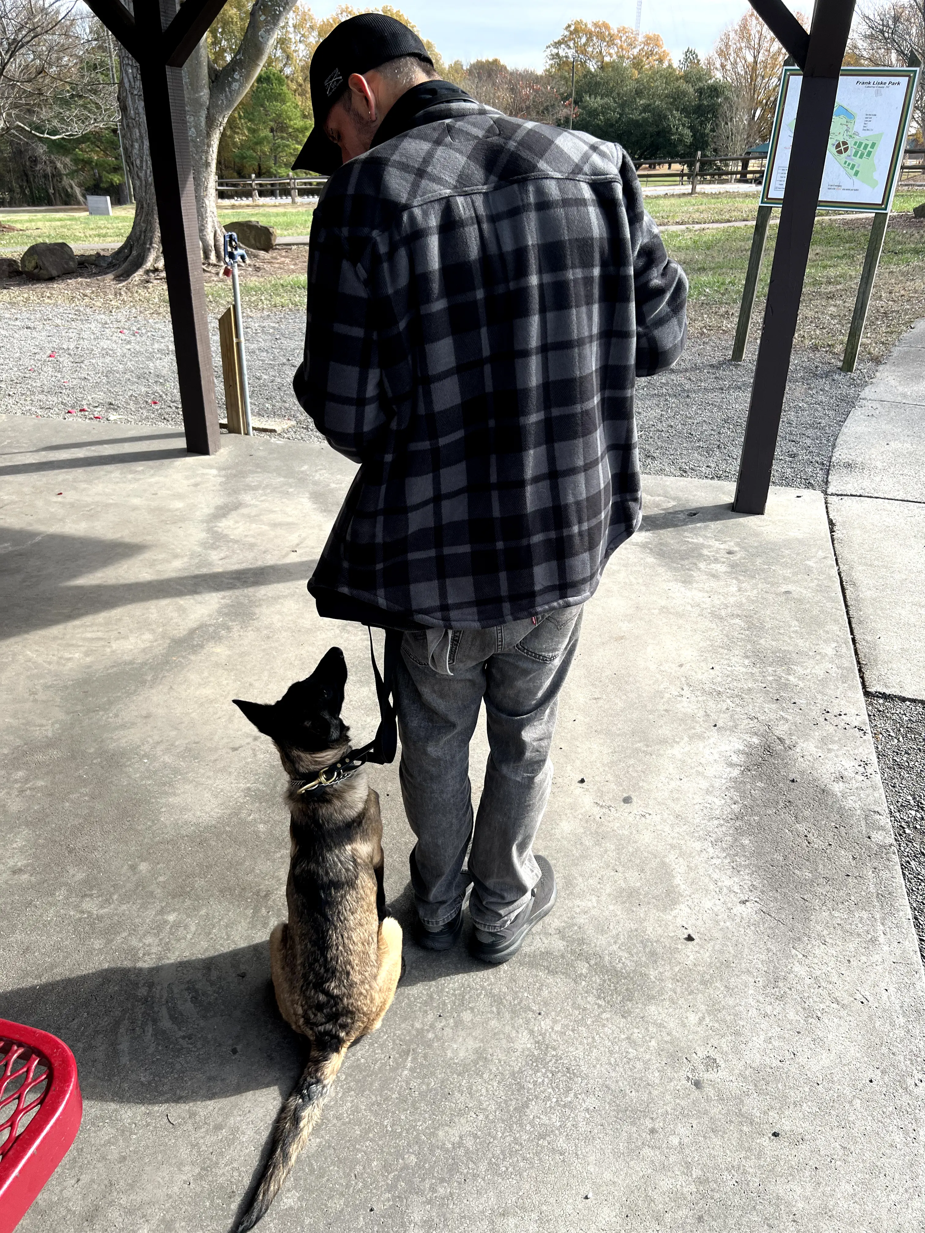 Jon and Client's Dog Shadow Training in covered park area