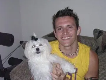 Young Jon Palacio with a dog